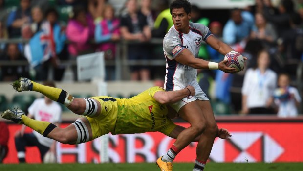 Unstoppable: Maka Unufe of USA is tackled by Nick Malouf of Australia in the final of the London Sevens.