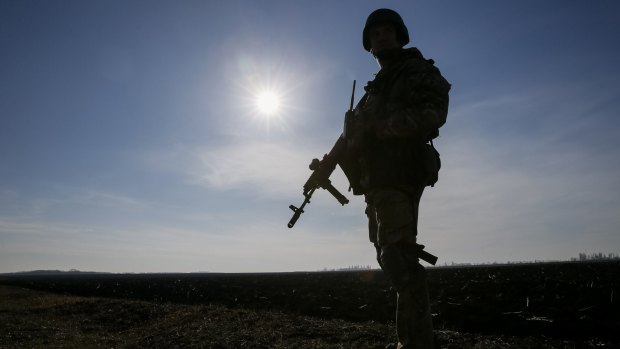 A member of the Ukrainian armed forces silhouetted at his position near Kramatorsk in Ukraine on Thursday.