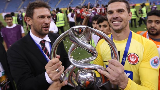 Tony Popovic and goalkeeper Ante Covic with the Asian Champions League trophy the Western Sydney Wanderers claimed on Saturday.