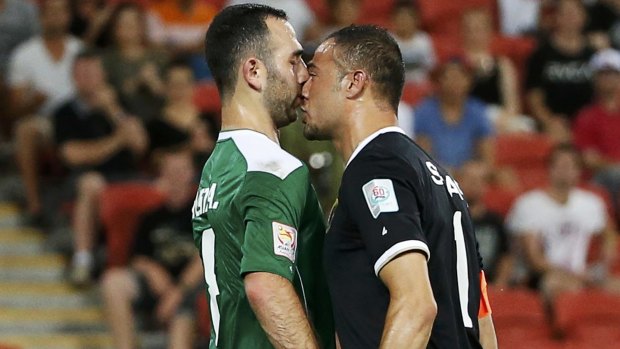 Close encounters: Iraq's Justin Hikmat Azeez and Jordan's goalkeeper Amer Shafi debate a point.