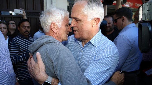 'This was a dad grieving for his son':  Malcolm Turnbull embraces Serge Oreshkin.
