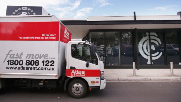 A moving van is seen parked outside the Carlton headquarters.