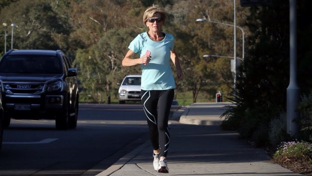 Foreign Affairs Minister Julie Bishop runs to Parliament House in Canberra on Wednesday.