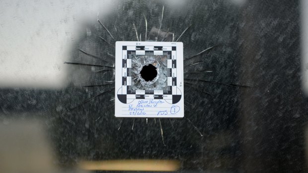 A bullet hole at the front of a police impound yard in Preston. 