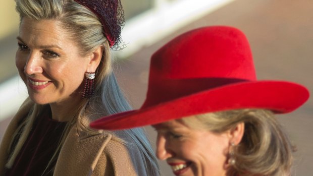 Netherlands' Queen Maxima, left, and Belgian Queen Mathilde arrive at the Cobra Museum in Amstelveen, near Amsterdam on Tuesday.