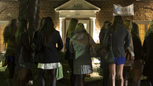 Calls to scrap "Greek system": Potential new members wait to enter a sorority house during spring fraternity rush near the University of Virginia campus in Charlottesville.