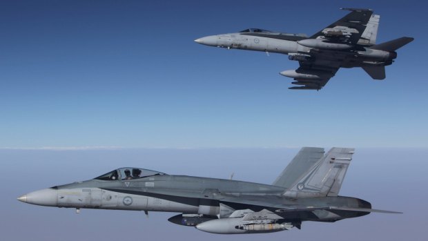 F/A-18A Hornets from Australia's Air Task Group fly in formation with a Royal Australian Air Force KC-30A Multi Role Tanker Transport aircraft.