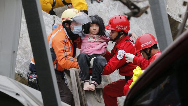 Eight-year-old Lin Su-Chin rescued from a collapsed building after an earthquake in Tainan.