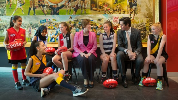 Young footballers Yasmine Taleb, Amren Abrahim, Laila Rabbah, Charlie Clayton, Abbey Boorman and Jayda Young with AFL commissioner Simone Wilkie and AFL CEO Gillon McLachlan.