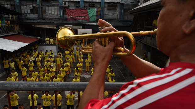 Inmates go through their morning routine at Quezon city jail.