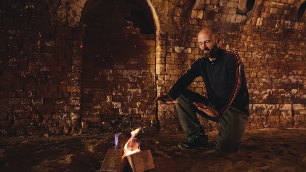Thor's Hammer owner Thor Diesendorf with the fire bricks he is making from waste sawdust at the Canberra Brickworks. 