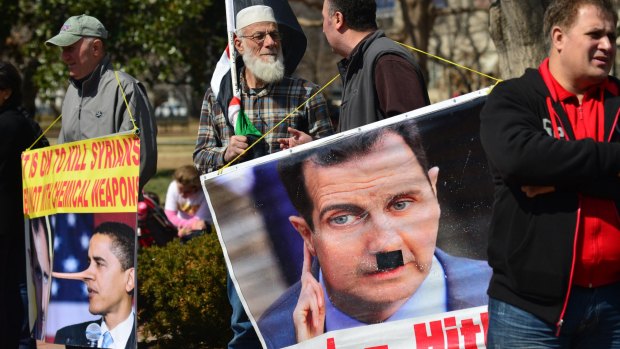 Peace activists gather in front of the White House for the reading of the names in March 2014.