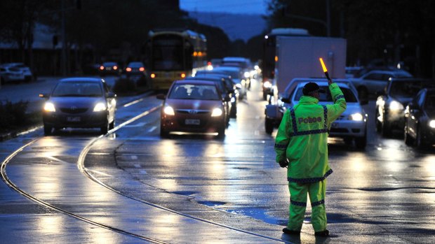 Police direct traffic around the CBD in Adelaide on Wednesday afternoon.