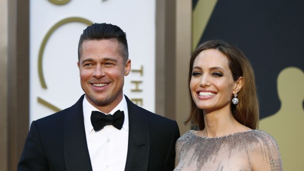 Actor Brad Pitt and actress Angelina Jolie arrive at the 86th Academy Awards in Hollywood, California.