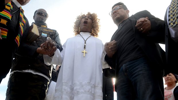 Dr Jeannetta Million of Victorious Believers Church leads a group of local pastors in a brief prayer vigil in San Bernardino.