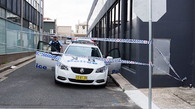 Police guard the laneway where the two boys were arrested in October.