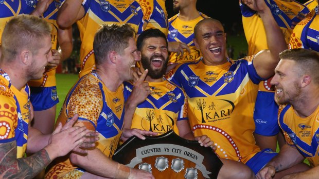 Final countdown: The City team celebrate with the shield after victory against Country this year.