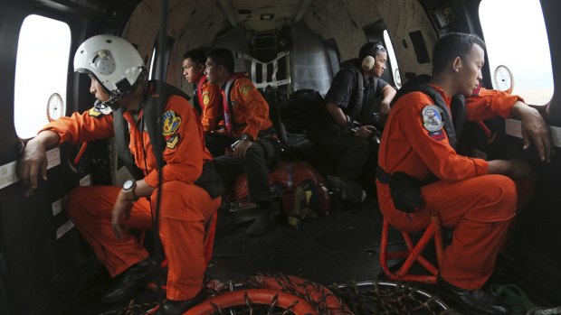Hope: Indonesia air force members during a search operation for the missing plane.