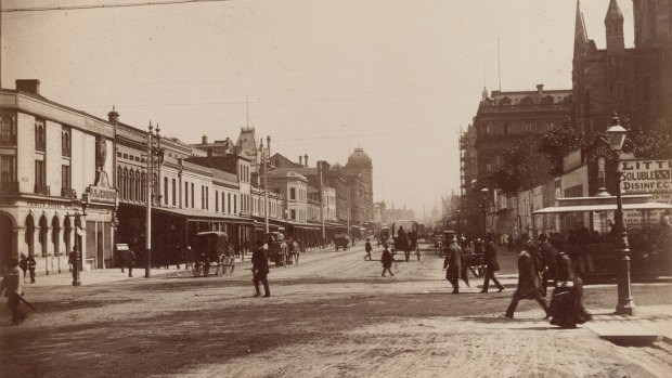 Then: Swanston Street in 1880, looking north towards St Paul's Cathedral and what's known today as Young and Jackson hotel.