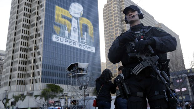 Prepared: A San Francisco Police tactical unit officer patrols Super Bowl City in San Francisco at the weekend.