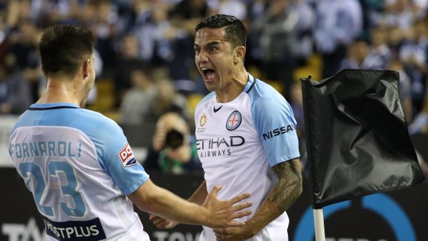 Shot and awe: Tim Cahill celebrates with Bruno Fornaroli after scoring against Melbourne Victory.