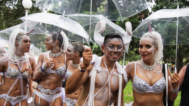 Rain comes down before the start of the 2017 Sydney Gay and Lesbian Mardi Gras. 