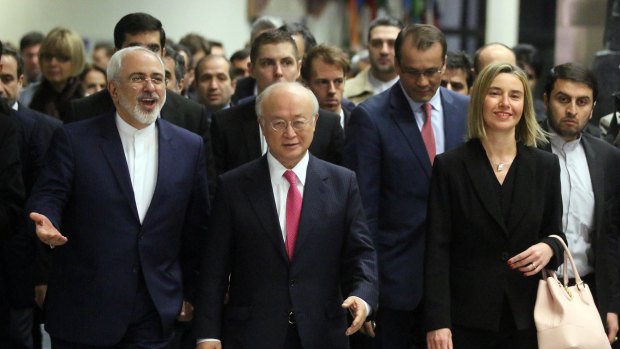 Iranian Foreign Minister Mohammad Javad Zarif, left, IAEA Director Yukiya Amano and EU High Representative Federica Mogherini, right, arrive at the IIAEA, in Vienna, on Saturday.