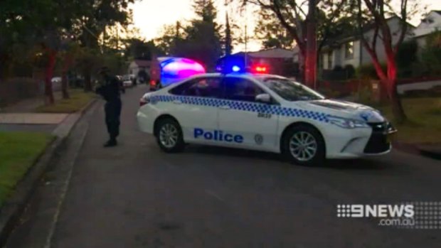 Police block off the street where the pair were stabbed.