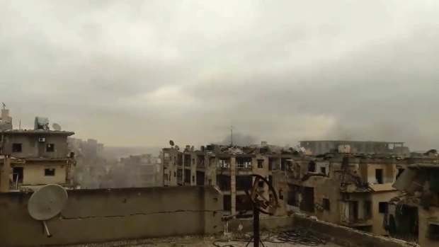Smoke rises in the distance to the sound of heavy bombardment in east Aleppo on Wednesday.