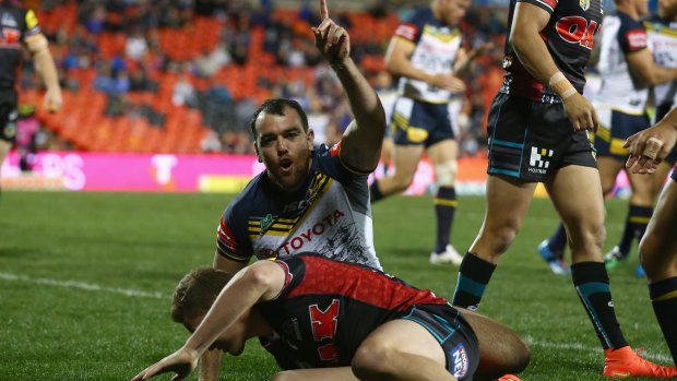 Premature celebration: North Queensland centre Kane Linnett rejoices after his early try but the Panthers had the last laugh.