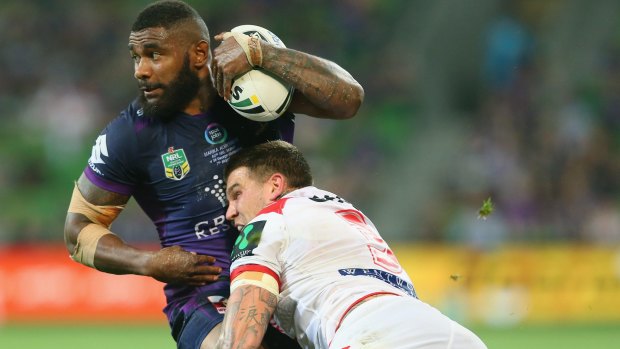 Try machine: Marika Koroibete is driven back by Josh Dugan.