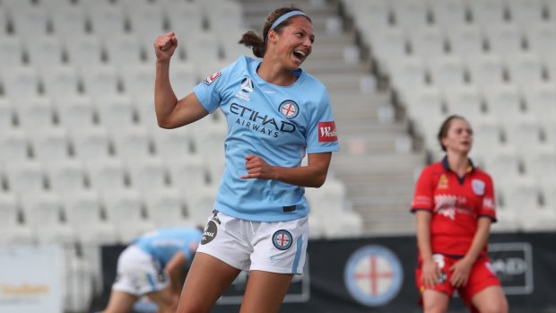One up: Ashley Hatch after scoring the opening goal of the match for City against the Reds at Lakeside Stadium in Melbourne.