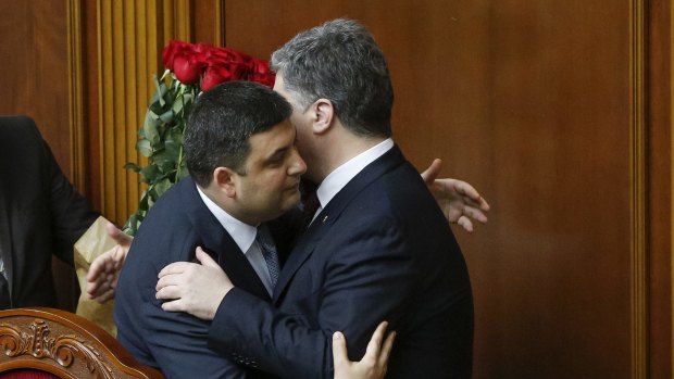 Ukraine's President Petro Poroshenko (right) and newly elected Prime Minister Volodymyr Groysman celebrate after Mr Groysman's appointment. 