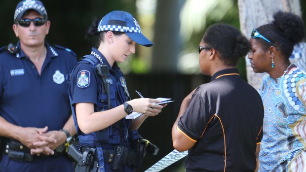 Australian police speak to people near  where eight children were found dead in Cairns.