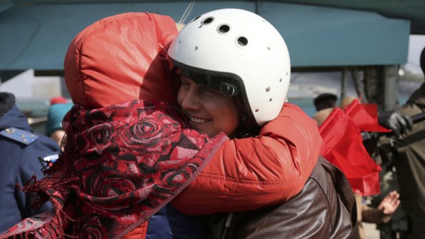 A Russian pilot is welcomed after returning from Syria at an airbase near the Russian city Voronezh on Tuesday.