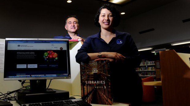 Librarians Dimitris Lioulios and Amanda Diedricks, at the Dickson Library, have both been trained to use the new program eSafe that makes it easier for young people to report cyber bullying.