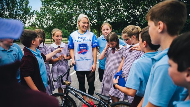 Caroline Buchanan with year 5 students from her childhood school, St John Vianney's Primary in Waramanga on Monday.