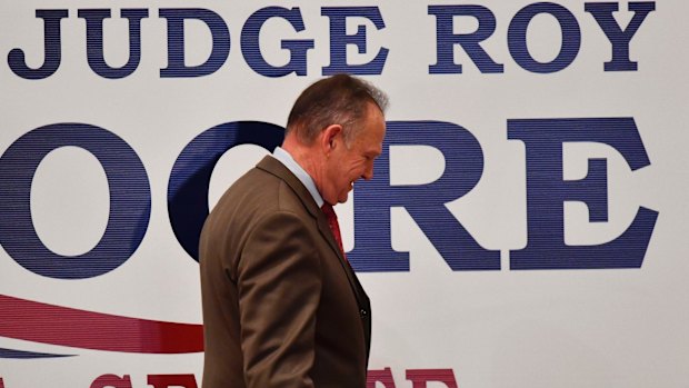 US Senate candidate Roy Moore leaves the stage after giving a speech at the end of his election-night watch party in Montgomery, Alabama.