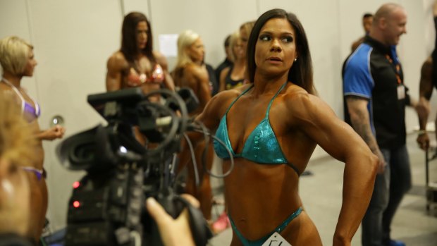 A still from Destination Arnold, a new SBS show about the road to the Arnolds, a female bodybuilding competition.