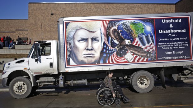 A truck bearing an image of Donald Trump outside a campaign rally in Council Bluffs, Iowa, on Sunday.