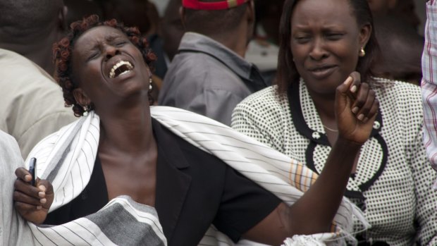 A woman  cries after she viewed the body of a relative killed in Thursday's attack on a university.