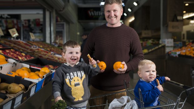 Pete Bromhead, from Jerrabomberra, with his boys Herby, 3, and Oscar, 1, shopping at Fyshwick markets. 