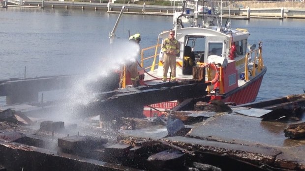 A firefighting boat attacks a pier fire at North Wharf Road, Docklands, on Saturday.