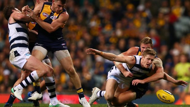 Cat Scott Selwood is tackled by Nathan Vardy.