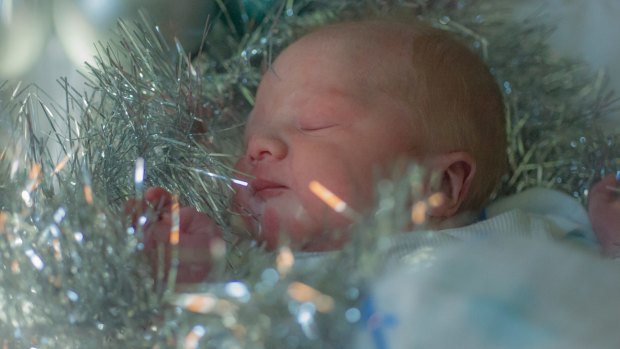 Canberra's first Christmas baby was born after a three-day labour to parents Stella Vongdara and Alex Pabian at the Canberra hospital. 