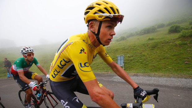 Chris Froome holds a slender lead in the Tour de France