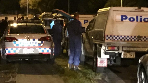 Forensic officers outside the home in Mt Gravatt-Capalaba Rd, Mackenzie, on Sunday, where a 10-year-old boy was found dead.