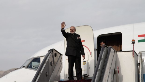 Indian Prime Minister Narendra Modi boards his plane at Kabul International Airport in Afghanistan on Friday. India donated four Mi-25 attack helicopters to the Afghan air force.