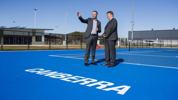 Tennis ACT chief executive Ross Triffitt, right, is turning over every blade of grass to bring the Davis Cup to Canberra.
