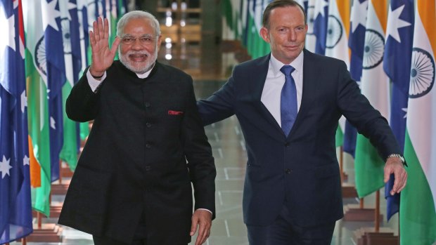 India's Prime Minister Narendra Modi and Prime Minister Tony Abbott, leave the House of Representatives at Parliament House following the G20 summit.